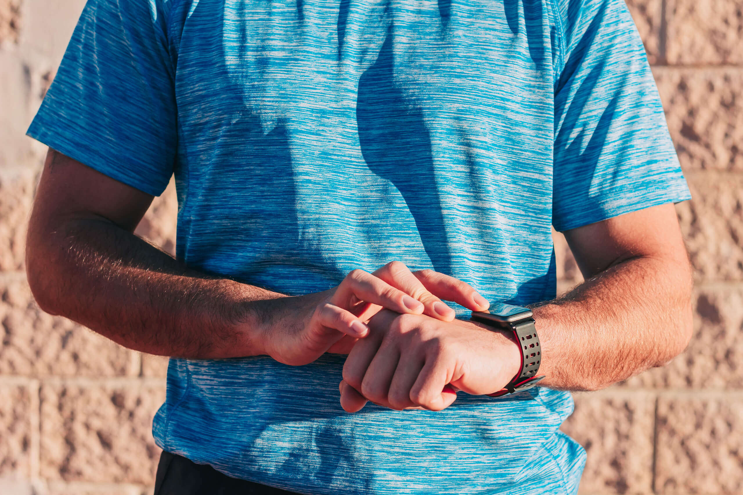 Male Runner And Athlete Using His Smartwatch1